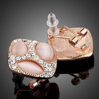 Close up of KHAISTA popping eyes emoji crystal stud earrings