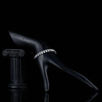 Side angle view of KHAISTA princess cut pave crystal bracelet