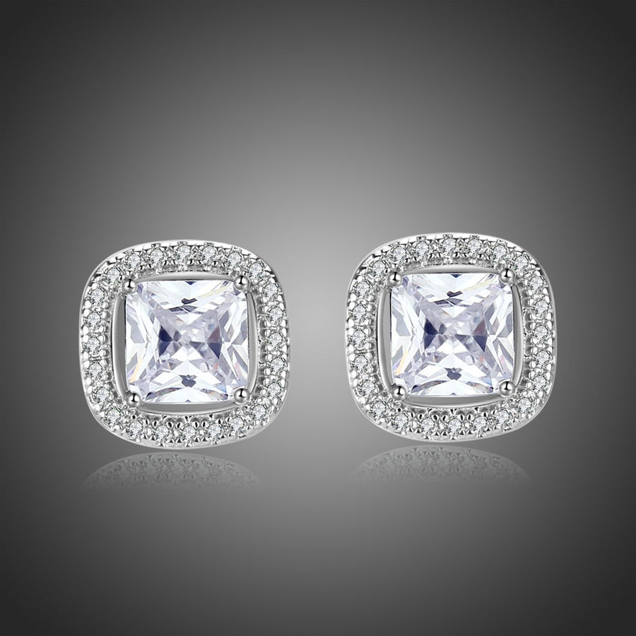 KHAISTA prong set square crystal stud earrings on white background