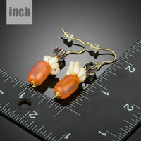 pumpkin orange crystal drop earrings detail view by KHAISTA