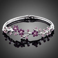 KHAISTA purple blossom twig bangle on white background