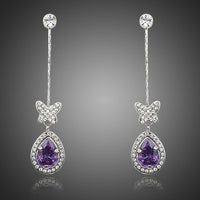 KHAISTA purple butterfly zirconia drop earrings on white background