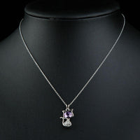 Close up detail of KHAISTA purple crystal cat pendant necklace