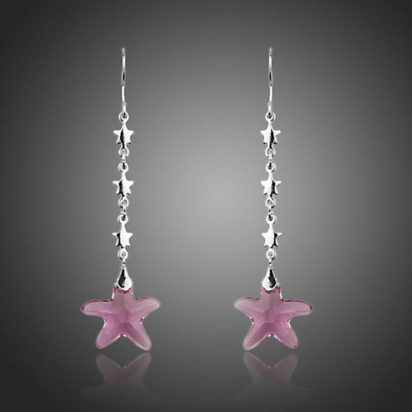 KHAISTA purple crystal star drop earrings on white background