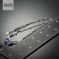 Pendant detail on KHAISTA purple CZ butterfly pendant necklace