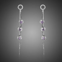 KHAISTA purple CZ drop earrings on white background