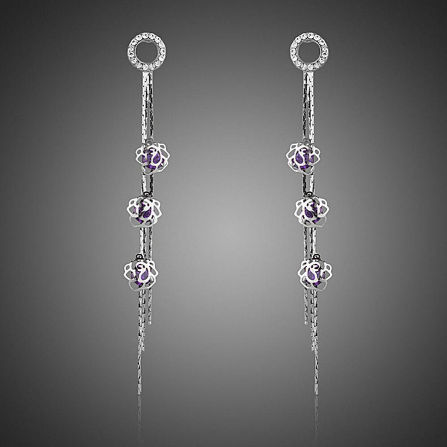 KHAISTA purple CZ drop earrings on white background