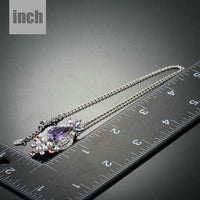 Pendant detail on KHAISTA purple CZ imitation pearl necklace