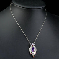 Close up detail of KHAISTA purple CZ imitation pearl necklace