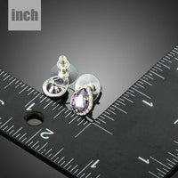purple CZ pear shaped stud earrings detail view by KHAISTA