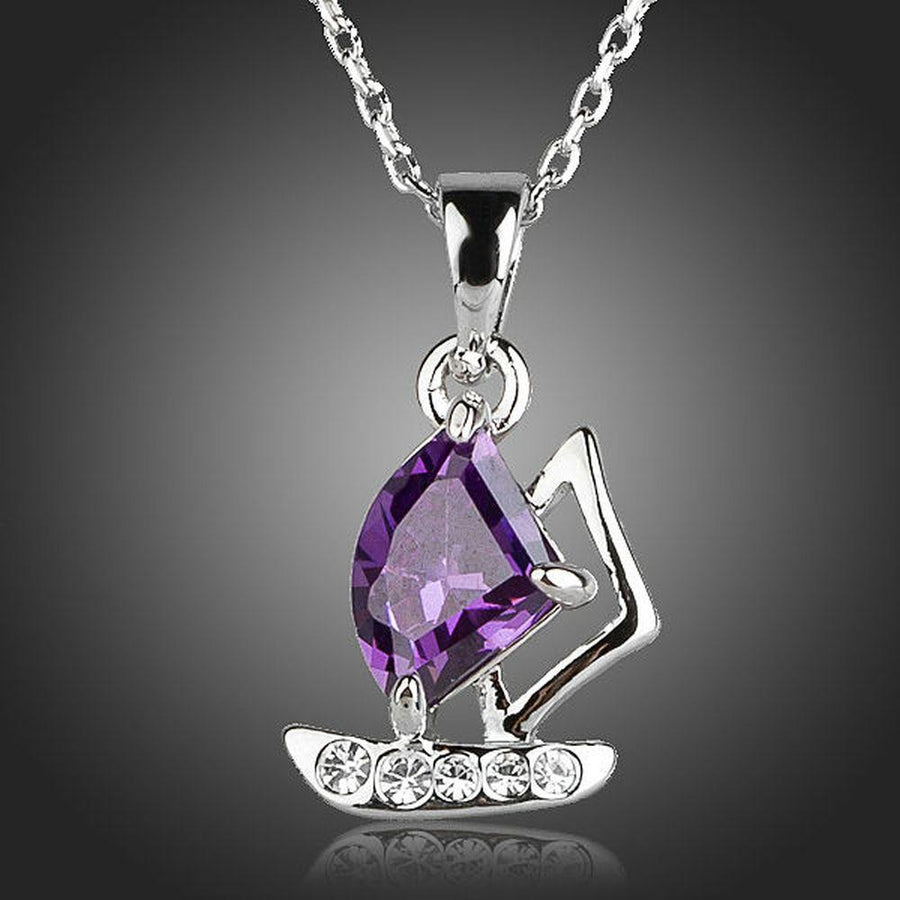 KHAISTA purple CZ sail boat necklace on white background