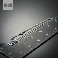 Pendant detail on KHAISTA purple CZ sail boat necklace