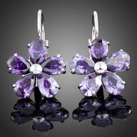 KHAISTA purple daisy crystal stud earrings on white background