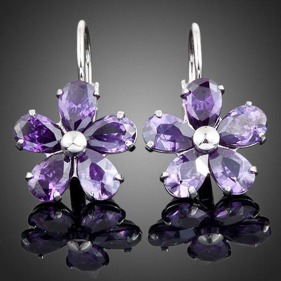 KHAISTA purple daisy crystal stud earrings on white background