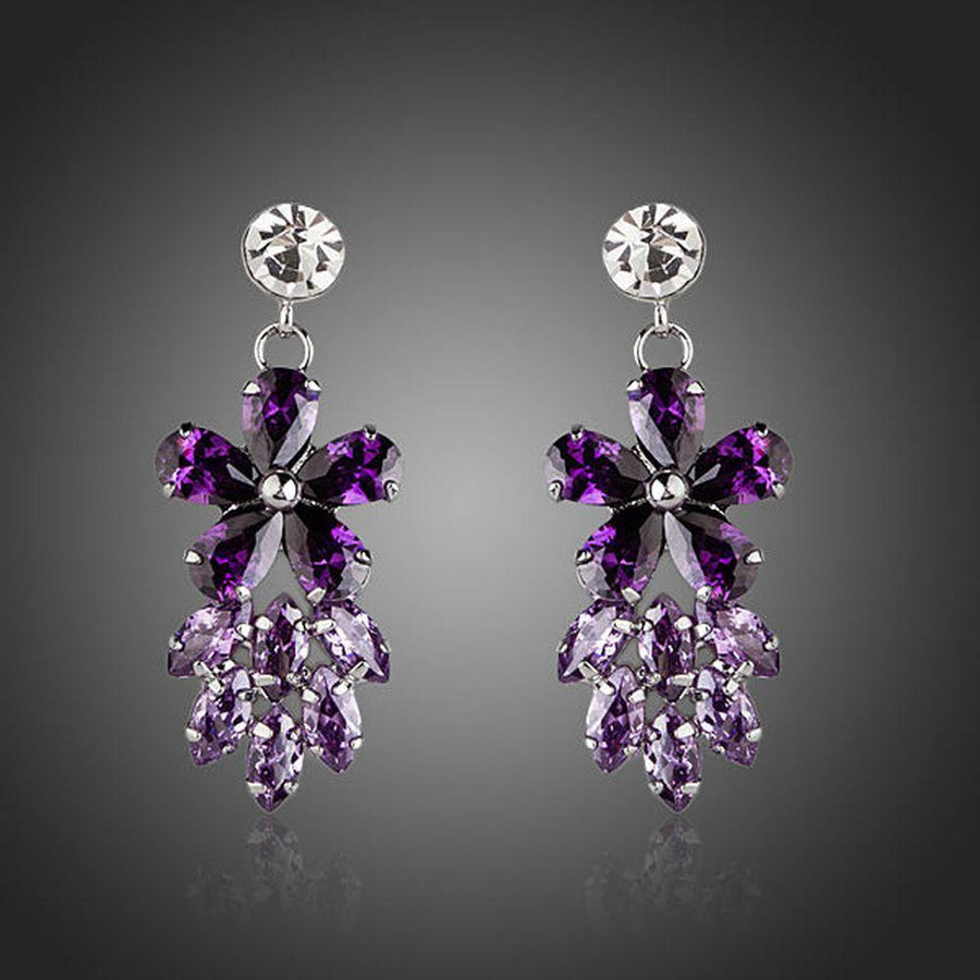 KHAISTA purple flower cluster drop earrings on white background