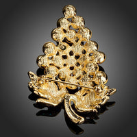 Close up of purple grapes on KHAISTA diamante brooch