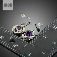 purple halo crystal drop earrings detail view by KHAISTA