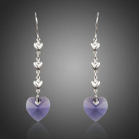 KHAISTA purple heart design crystal drop earrings on white background