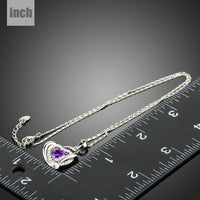 Close up detail of KHAISTA purple crystal heart pendant necklace