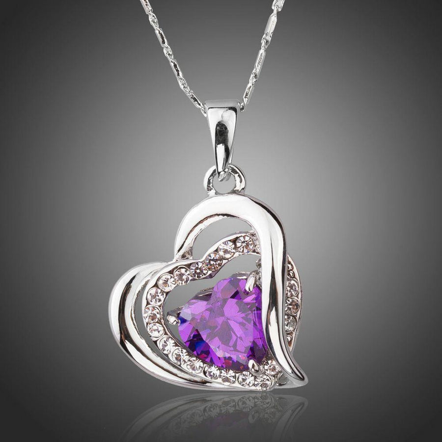 KHAISTA purple crystal heart pendant necklace on white background