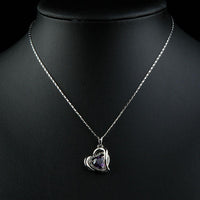 Pendant detail on KHAISTA purple crystal heart pendant necklace