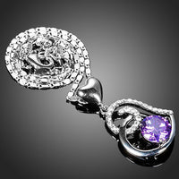 Close up detail of KHAISTA purple heart pendant chain necklace