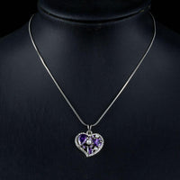 Close up detail of KHAISTA purple crystal heart pendant necklace