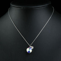 Close up detail of KHAISTA purple leaf drop crystal necklace