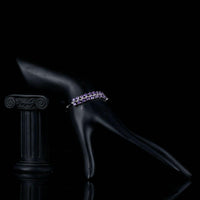 Side angle view of KHAISTA purple crystal bow knot bracelet