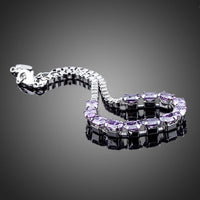 Close up detail of KHAISTA purple CZ link chain bracelet