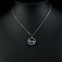 Close up detail of KHAISTA purple lotus flower pendant necklace