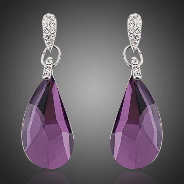 KHAISTA purple raindrop crystal drop earrings on white background