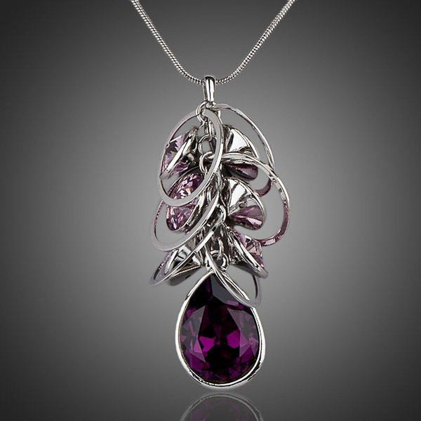 KHAISTA purple Stellux Austrian crystal pendant necklace on white background