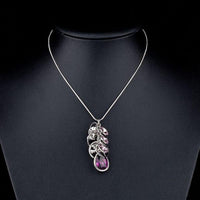 Close up detail of KHAISTA purple Stellux Austrian crystal pendant necklace