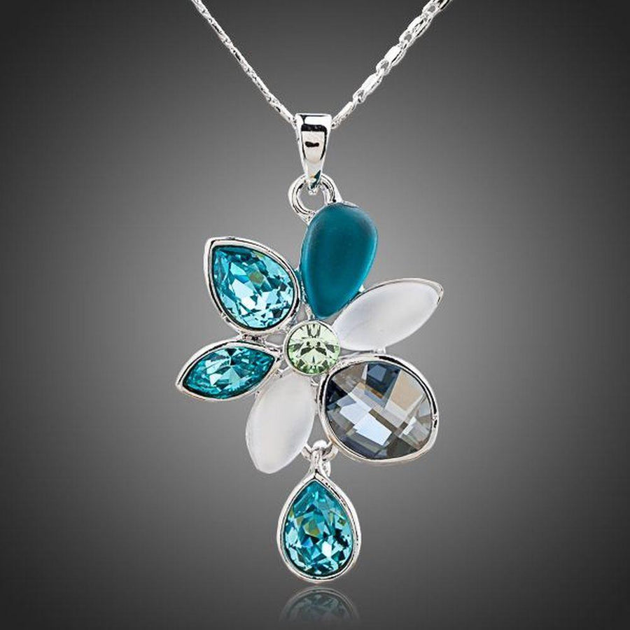 KHAISTA raindrop daisy crystal pendant necklace on white background