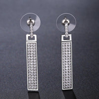 rectangle paved CZ dangle earrings detail view by KHAISTA