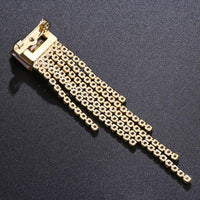 Side angle view of Khaista champagne tassel brooch