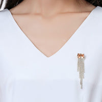 Close-up of champagne zirconia on Khaista tassel brooch