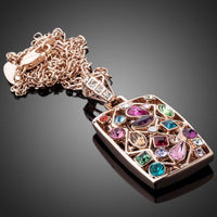 Close up detail of KHAISTA rainbow crystal rectangle pendant necklace