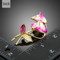 Close-up of red stones on Khaista artistic flower brooch