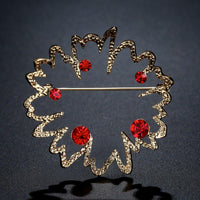 Flower rhinestone detail on Khaista red brooch