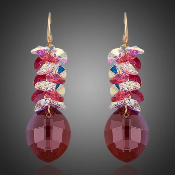 KHAISTA red crystal vine drop earrings on white background