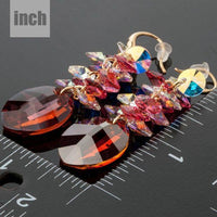red crystal vine drop earrings detail view by KHAISTA