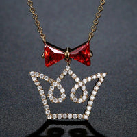 KHAISTA red CZ bow knot crown pendant necklace on white background
