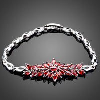 KHAISTA red cubic zirconia chain bracelet on white background