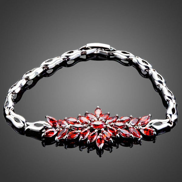 KHAISTA red cubic zirconia chain bracelet on white background