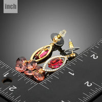 red CZ dangle earrings detail view by KHAISTA