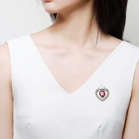 Side angle view of Khaista red double heart brooch