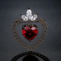Close-up of red CZ stones on Khaista heart brooch