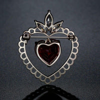 Double heart design detail on Khaista red CZ brooch
